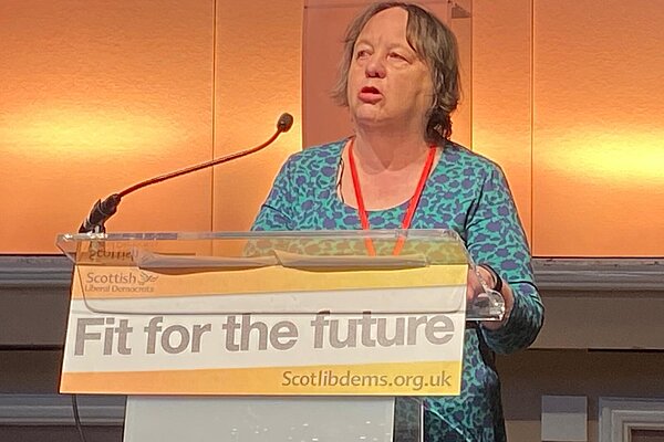 Jacquie speaking at conference